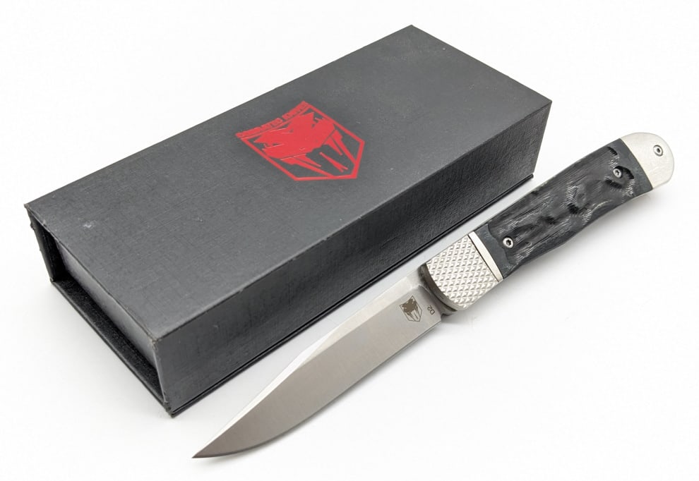 NIB CobraTec Trapper Switchblade Auto: NIB CobraTec Trapper Switchblade Auto. Knife features a clip point blade, textured bolster blade release, and black bone handle scales. Knife is in new condition. Overall measures 4-1/4in when closed.
