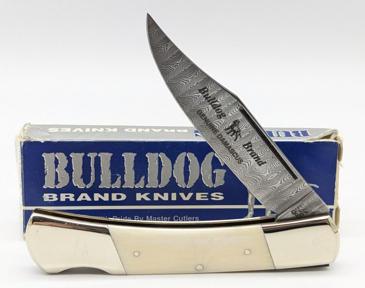 1997 Bulldog Brand Exotic Bone Damascus 1 of 5: 1997 Ltd Bulldog Brand Rare Exotic Bone Damascus Lockback w/ Box. Knife is 1 of 5 and is in like new condition. Overall measures 4-3/8in when closed. Ref #: 298