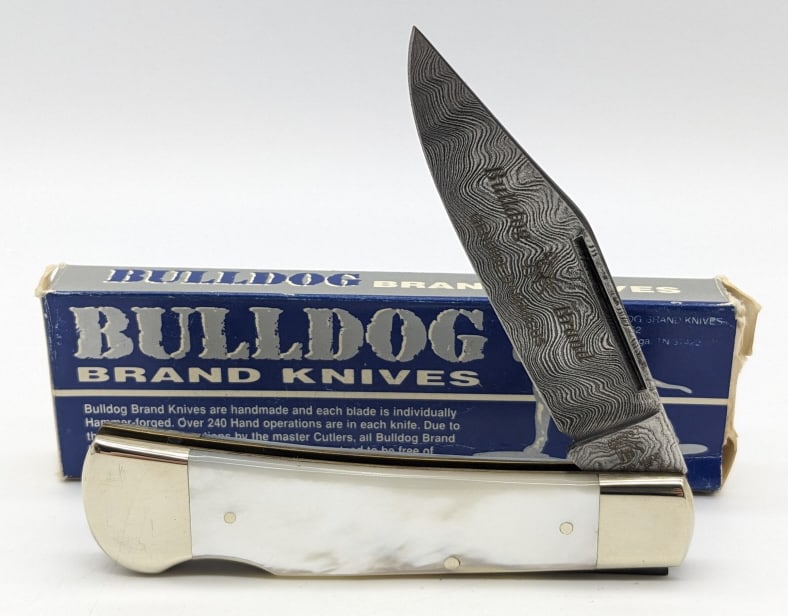 1997 Bulldog Brand Pearl Damascus Knife 1 of 60: 1997 Ltd Bulldog Brand Pearl Bone Damascus Lockback w/ Box. Knife is 1 of 60 and is in like new condition. Overall measures 4-3/8in when closed. Ref #: 300