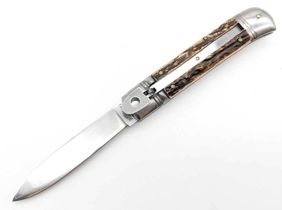 Rostfrei Stag Handle Leverlock Switchblade Knife: Rostfrei Stag Handle Leverlock Switchblade Knife. Knife is in very nice condition with stag handle scales, very strong spring, and locks tight when open. Overall measures 4-3/4in when closed. Ref #: 3