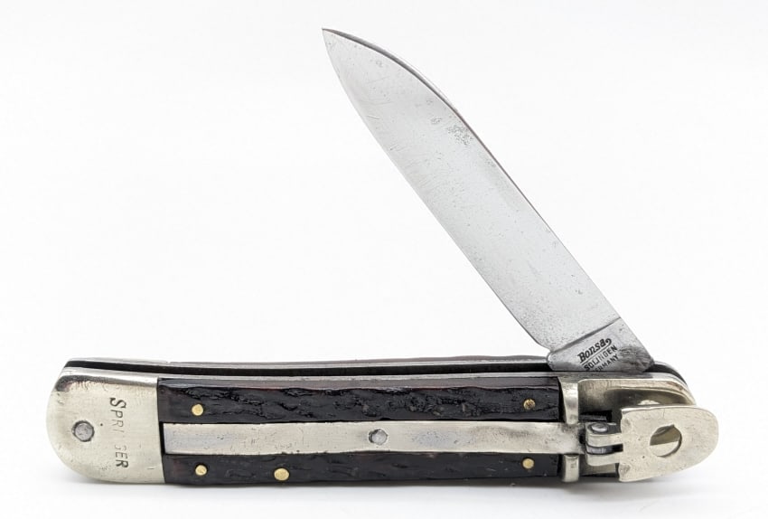 Bonsa Springer Solingen Leverlock Switchblade Knife: Bonsa Springer Solingen Leverlock Switchblade. Knife is in nice condition with a strong spring, scuffs on the blade, scuffs and dings on the bolsters, and nice jig bone handle scales. Overall measures