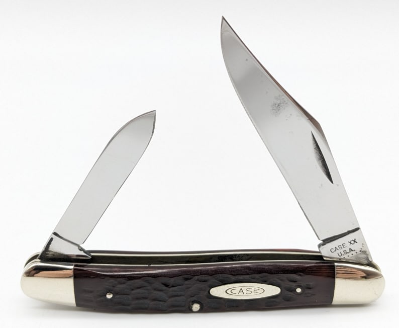 1974 Case XX Jigged Bone Medium Stockman 06247: 1974 Case XX Jigged Bone Medium Stockman 06247. Knife is in nice polished condition with some small carbon spots on the blades, and scuffs on the bolsters from age and handling. Overall measures 4in w