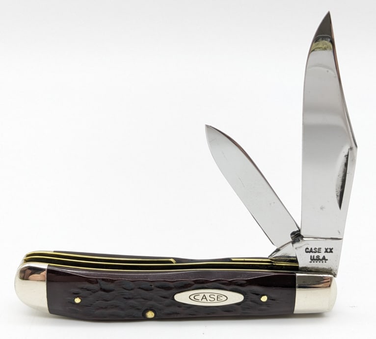 1974 Case XX Jigged Bone Mini Trapper Knife 6207: 1974 Case XX Jigged Bone Mini Trapper 6207. Knife is in very nice condition with some carbon spots on the blades, and scuffs on the bolsters from handling. Overall measures 3-1/2in when closed. Ref #: