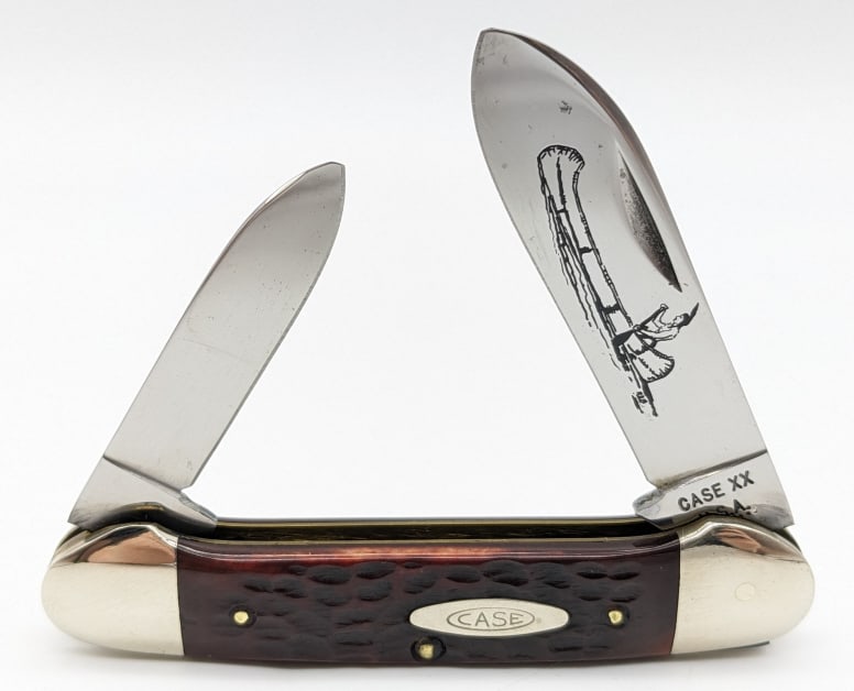 1974 Case XX Jigged Red Bone Canoe Knife 62131: 1974 Case XX Jigged Red Bone Canoe Knife 62131. Knife is in very nice condition with light wear and canoe etching on the blades, and scuffs on the bolsters from handling and age. Overall measures 3-5/