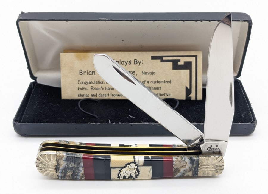 2006 Case XX Yellowhorse Mammoth Trapper 1 of 100: 2006 Case XX Ltd Brian Yellowhorse Mammoth Tooth Trapper. Knife is numbered 002 of 100 and features engraving on the bolsters, and natural stone and mammoth tooth handle scales. Knife is in like new c