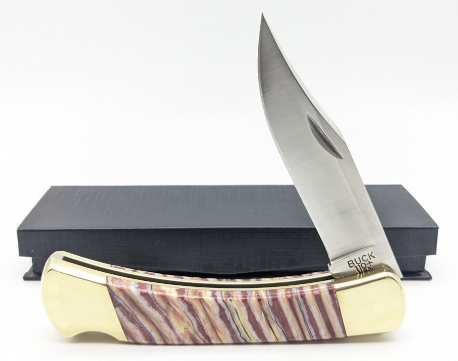Custom Buck 110 Mammoth Tooth Lockback Knife 1 of 1: Custom Mike Newland Buck 110 Mammoth Tooth Lockback. Knife is 1 of 1 and features multi colored stabalized mammoth tooth handle scales. Knife is in like new condition. Overall measures 4-7/8in when cl