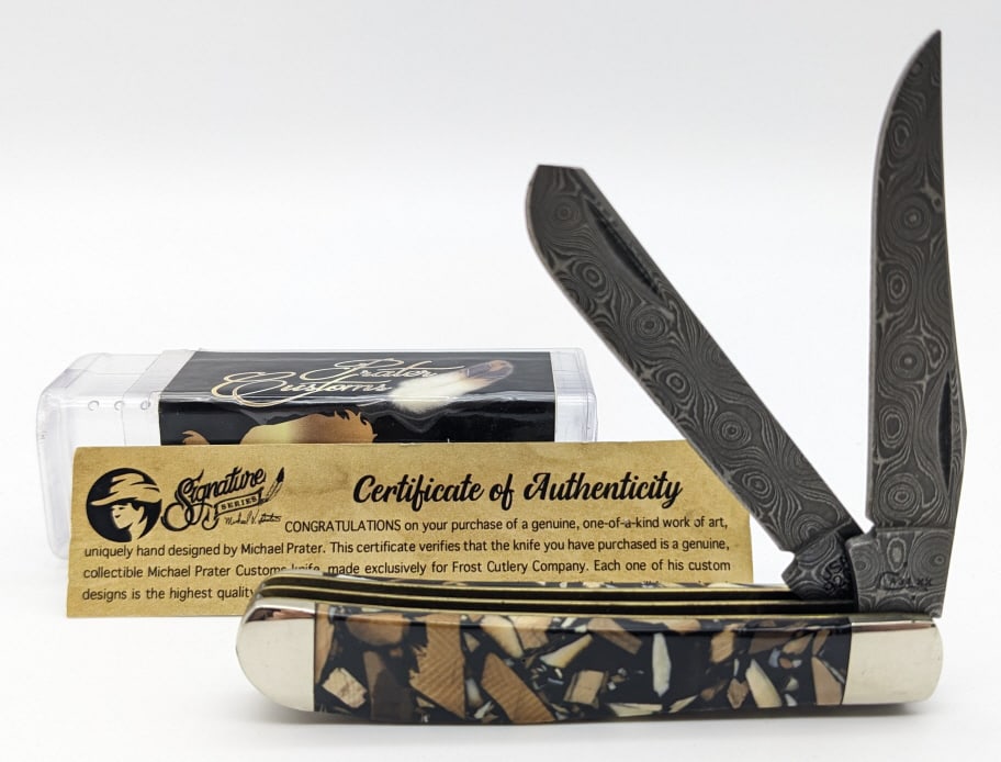 2018 Case XX Prater Mammoth Tooth Damascus Knife: 2018 Case XX Michael Prater Mammoth Tooth Mini Trapper. Knife features Raindrop damascus blades, and chipped mammoth tooth handle scales suspened in black acrylic. Knife is in like new condition. Over