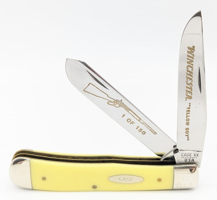 1981 Case XX Winchester Yellow Boy Trapper Knife 1 of 150: Ltd 1981 Case XX Winchester Yellow Boy Trapper 3254. Knife features Winchester branding and rifle etching on the blades, synthetic yellow handle scales, and is numbered 013 of 150 on the upper front b