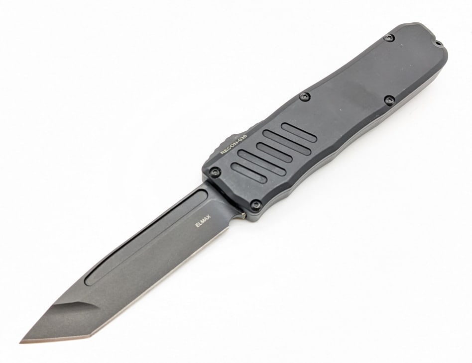 Guardian Tactical Recon-035 Black Tanto OTF Knife: Guardian Tactical Recon-035 Black Tanto OTF Knife. Knife features a black finish tanto fullered blade, and black aluminum handle with lanyard hole. Knife is in good condition with no apparent wear on 