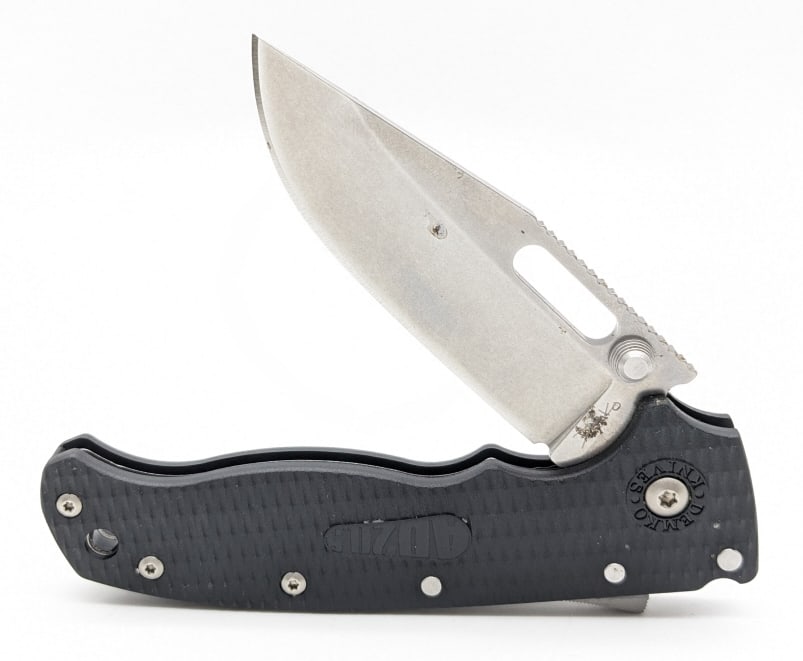 Demko Knives AD20.5 Shark Lock Clip Point Knife: Demko Knives AD20.5 Shark Lock Clip Point Knife. Knife features a stonewash finish clip point blade with thumb notches, black polymer handle scales, and unique shark fin locking mechanism. Knife is in