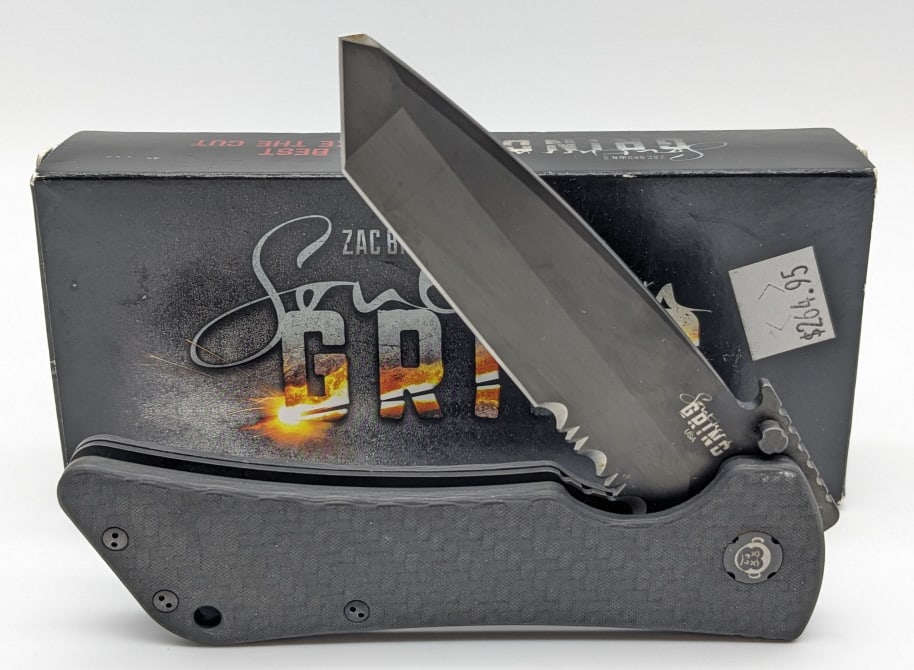NIB Southern Grind Bad Monkey Carbon Fiber Tanto Knife: NIB Zac Brown's Southern Grind Bad Monkey Carbon Fiber Tanto. Knife was designed by Emerson and features a black finish partially serrated tanto blade, and carbon fiber handle. Knife is in new conditi