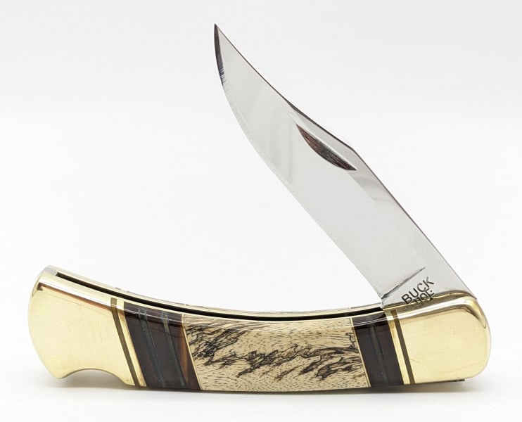 Buck 110 Custom Bone & Celluloid Folding Hunter: Buck 110 Custom Bone & Celluloid Folding Hunter. Features a polished metal blade, polished brass bolsters, and bone and red celluloid handle scales. Knife is in like new condition. Overall measures 4-