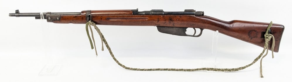 WWII Italian Carcano M1891/38 7.35 x 51 Bolt Rifle: WWII Italian Carcano M1891/38 7.35mm x 51 Bolt Action Rifle. Features a 21in barrel, receiver dated 1939, blued finish, and smooth wood stock with arsenal mark and serial number stamped on the left si