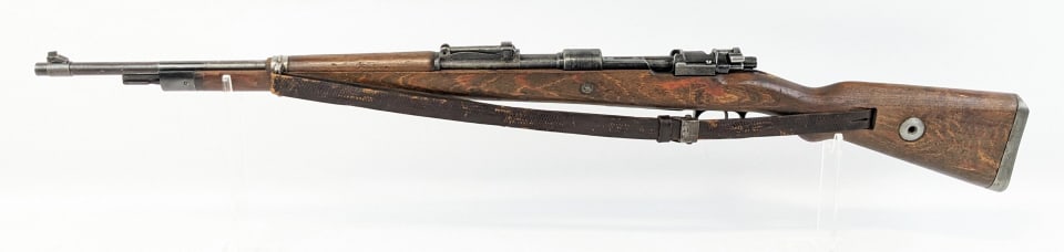 WWII German K98 8mm Mauser Bolt Action Rifle: WWII German K98 8mm Mauser Bolt Action Rifle. Features a 23-1/2in barrel, worn blued finish, German acceptance marks, original leather sling, and smooth wood stock. Rifle is nice aged condition with s