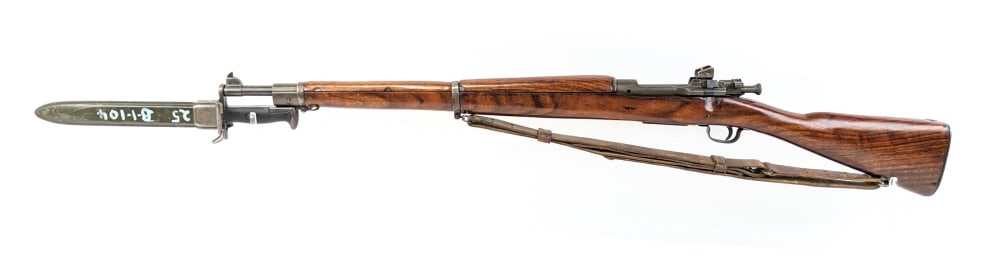 WWII US Remington 03-A3 30-06 Bolt Action Rifle: WWII US Remington 03-A3 30-06 Bolt Action Rifle w/ Bayonet. Features a 24in barrel stamped RA 2-43 with the flaming bomb, parkerized finish, smooth wood stock, and original leather sling. Bayonet is m