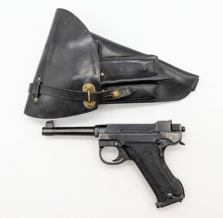 Swedish Husqvarna Model 40 9mm Pistol w/ Holster: Swedish Husqvarna Model 40 9mm Pistol w/ Holster. Pistol is in very nice condition with light holster finish wear and some scuffs from use and handling. FFL Required for Transfer. SN: D15208 (11-273)