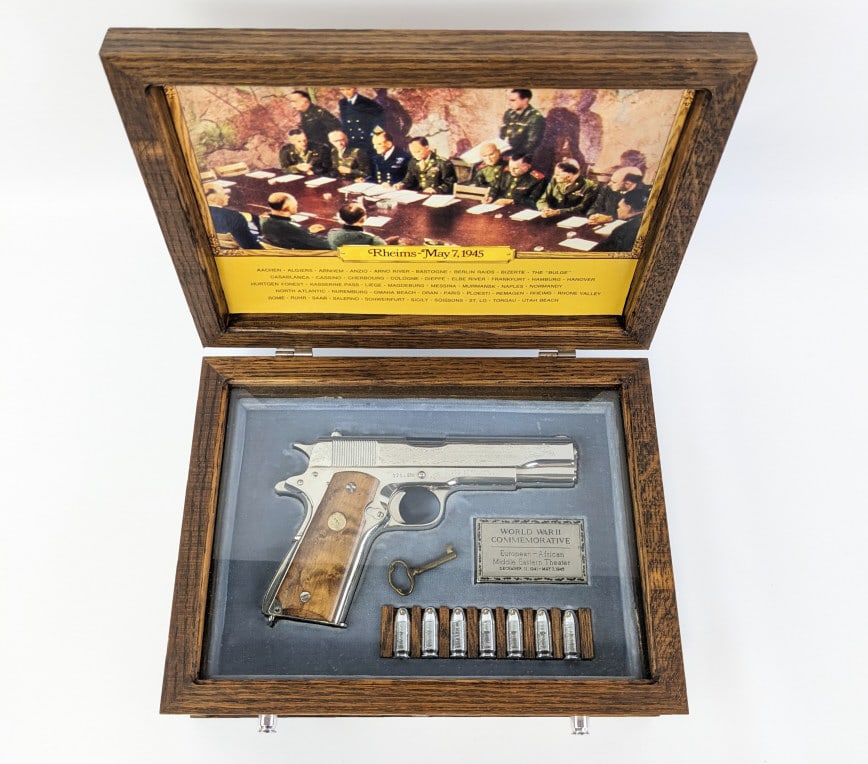 Colt WWII Comm European Theater 1911 45 ACP Pistol: Colt WWII Commorative European-African Theater M1911 .45 ACP Pistol w/ Case. Pistol comes in the display case with nickel plated bullets, and has matching serial numbers with the Pacific Theater M1911