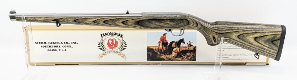 Ruger Model 10/22 22 LR Mannlicher Semi Auto Rifle: Ruger Model 10/22 .22 LR Mannlicher Semi Auto Rifle w/ Box. Features an 18-1/2in barrel, drilled and tapped scope mounts, stainless steel finish, and grey laminate mannlicher stock. FFL Required for T