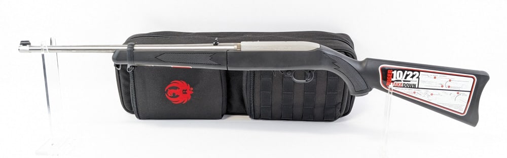 NIB Ruger Takedown 10/22 .22 LR Semi Auto Rifle: NIB Ruger Takedown 10/22 .22 LR Semi Auto Rifle w/ Pack & Box. Features an 18-1/2in barrel, drilled and tapped scope mount, stainless steel finish, and checkered black polymer stock. Rifle is in new c