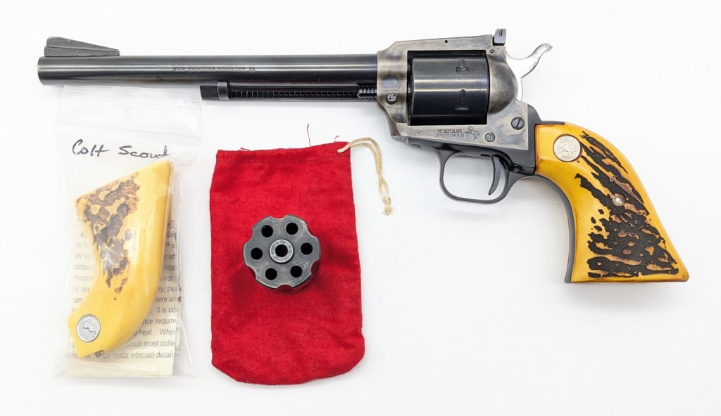 Colt New Frontier Buntline .22 Mag / LR Revolver: Colt New Frontier Buntline .22 Mag / LR Revolver. Comes with a .22 LR cylinder and extra faux stag grips. Revolver was made in 1974 and features a 7-1/2in blued finish barrel, adjustable rear sight, c