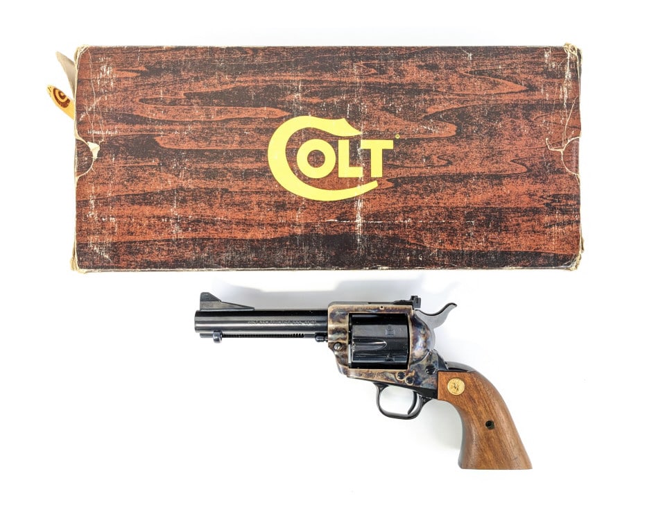 Colt New Frontier 44-40 Revolver w/ Box: Colt New Frontier 44-40 Revolver w/ Box. Features a 4-3/4in barrel, adjustable rear sight, blued finish barrel, color case hardened receiver, and smooth wood grips. Revolver is in like new condition w