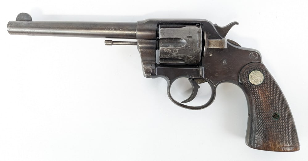 Colt DA Model 1892 .38 LC Double Action Revolver: Colt DA Model 1892 .38 LC Double Action Revolver. Based on the serial number this revolver was made in 1904. Features a 6in barrel, counter clockwise rotating cyinder, and checkered wood grips with th