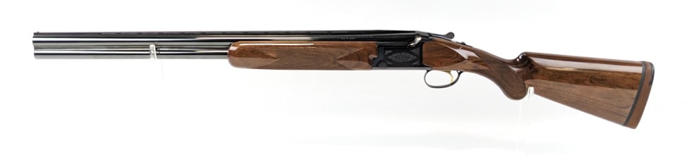 Browning Citori 12 Ga Over & Under Shotgun: Browning Citori 12 Ga Over & Under Shotgun. Features 26in barrels with internal choke threads, vented rib, blued finish, scroll engraving on the receiver, and checkered glossy wood stock. Shotgun is i