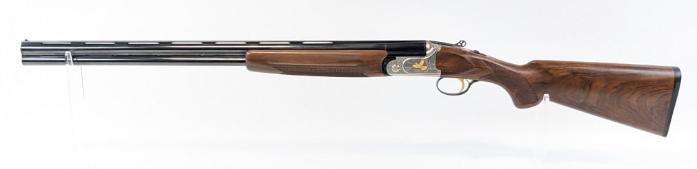 Franchi Veloce 20 Gauge O/U Shotgun: Franchi Veloce 20 Gauge O/U Shotgun. Shotgun features 27-1/2in barrels, flat top rib, fine engraved nickel finish receiver with gold tone inlays, engraved and tooled lever, and nice checkered walnut s