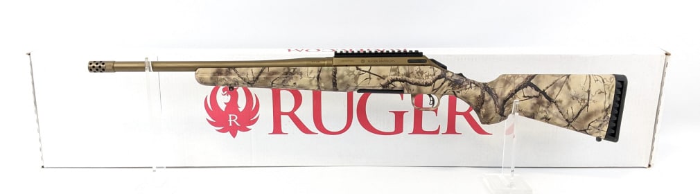 Ruger American 6.5 Creedmore Bolt Action Rifle: Ruger American 6.5 Creedmore Bolt Action Rifle w/ Box. Features a 17in threaded barrel with a flash hider, picatinny rail scope mount, bronze finish, and camo polymer stock. Rifle is in nice used cond