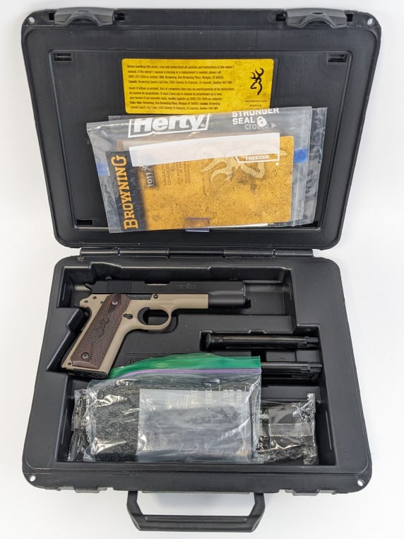 Browning 1911-22 .22 LR Semi Auto Pistol w/ Case: Browning 1911-22 .22 LR Semi Auto Pistol w/ Case. Comes in the original case with two extra mags and extra grips. Features a 4-1/4in barrel, black and tan cerakote finish, and checkered wood browning 