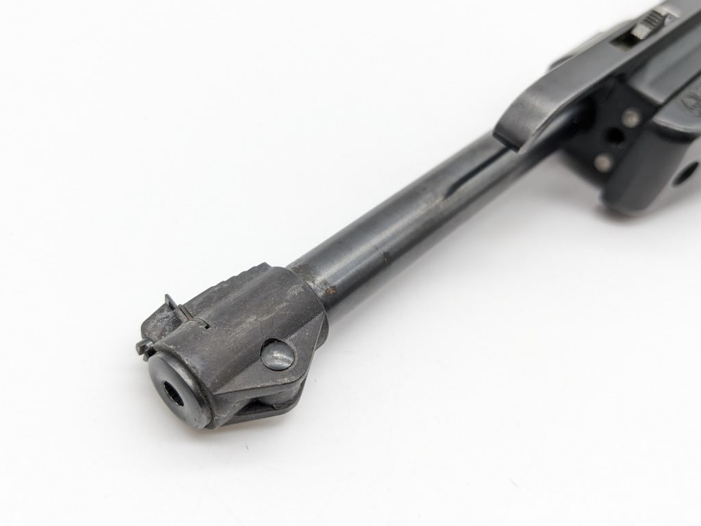 Feinwerkbau Model 65 .177 Cal Pellet Target Pistol: Feinwerkbau Model 65 .177 Cal Pellet Target Pistol. Comes with the original manuals and tooling. Features a 6in barrel, adjustable rear sight, matte black finish, and left handed wooden target grip wi