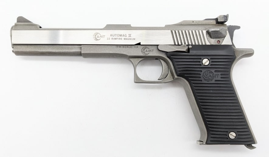 AMT Automag II .22 Mag Semi Auto Pistol: AMT Automag II .22 Mag Semi Auto Pistol. Features a 6in barrel, adjustable rear sight, stainless steel finish, and black plastic grips. Pistol is in very nice condition with light wear from use and ha