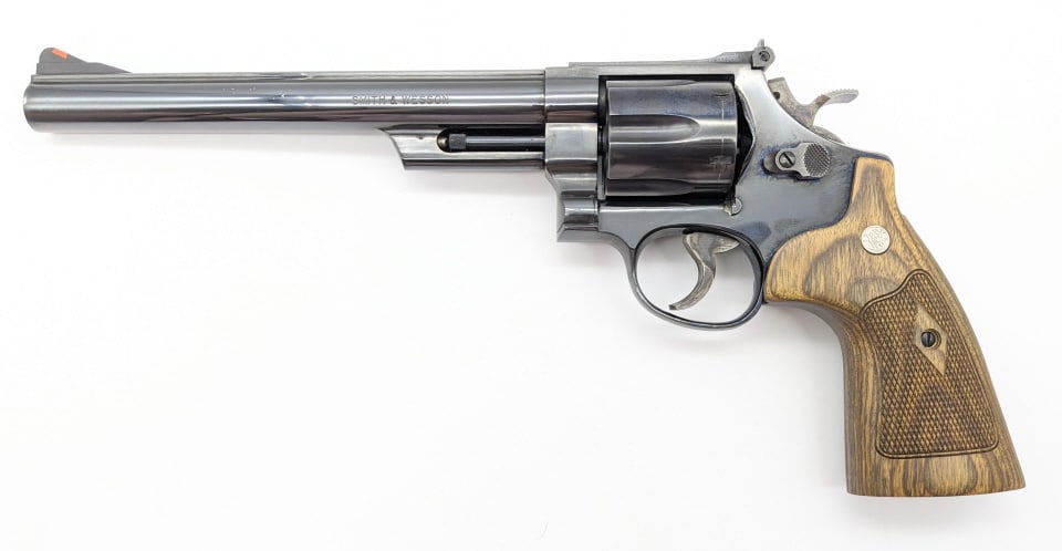 Smith & Wesson Pre 29 .44 Mag Target Revolver: Smith & Wesson Pre 29 .44 Mag Target Revolver. Features a 8-3/8in barrel, adjustable rear sight, target hammer, blued finish, color case hardened hammer and trigger, and checkered wood grips. Revolver