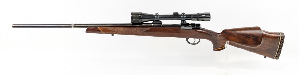 Interarms Zastava Mark X 7mm Bolt Action Rifle: Interarms Zastava Mark X 7mm Bolt Action Rifle. Features a 24in barrel, Weaver 3-9x scope, checkered bolt handle, blued finish, and checkered wood stock with cheek riser. Rifle is in condition and app