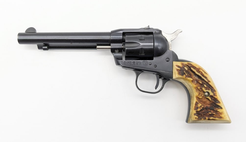 Ruger Single Six .22 LR Single Action Revolver: Ruger Single Six .22 LR Single Action Revolver. Features a 5-1/2in barrel, blued black finish, and custom stag grips. Revolver is in nice used condition with scuffs on the finish and some dings from u