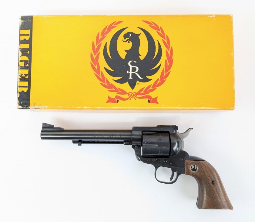 Ruger Blackhawk .357 Mag Revolver w/ Box: Ruger Blackhawk .357 Mag Revolver w/ Box. Features a 6-1/2in barrel, adjustable rear sight, blued black finish, and smooth wood grips. Revolver is in very nice condition with minimal wear from use and