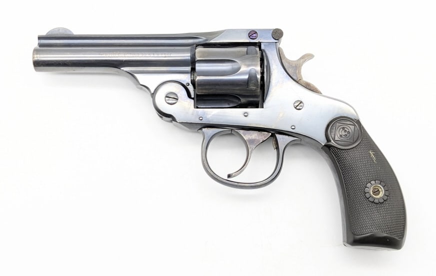 H&R Top Break .32 S&W 6-Shot Revolver: H&R Top Break .32 S&W 6-Shot Revolver. Features a 3-1/4in barrel, blued finish, and checkered brown plastic grips. Revolver is in good condition with finish wear, scuffs, and other light wear from use