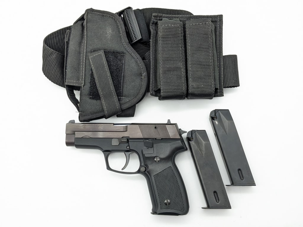 CZ Model 99 9mm Semi Auto Pistol w/ Holster & Belt: CZ Model 99 9mm Semi Auto Pistol w/ Holster & Belt. Comes with the holster, belt, mag pouch, and two extra magazines. Features a 4-1/4in barrel, blued black finish slide, matte black finish frame, and