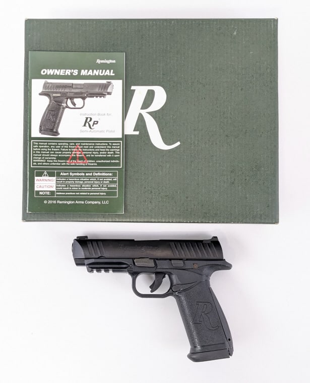 Remington RP9 9mm Semi Auto Pistol w/ Box: Remington RP9 9mm Semi Auto Pistol w/ Box. Comes in the original box with an extra magazine and grip extensions. Features a 4-1/2in barrel, under barrel rail, matte black finish, and balck polymer fra