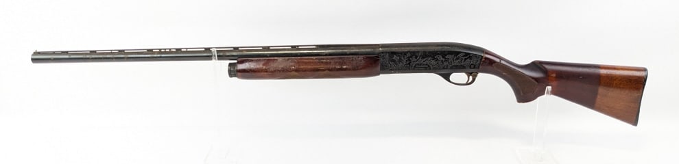 Remington Mod 58 Sportsman 12 Ga Semi Auto Shotgun: Remington Mod 58 Sportsman 12 Ga Semi Auto Shotgun. Features a 27-3/4in barrel, vented rib, duck hunting scene on the receiver, blued finish, and checkered wood stock. Shotgun is in worn condition wit
