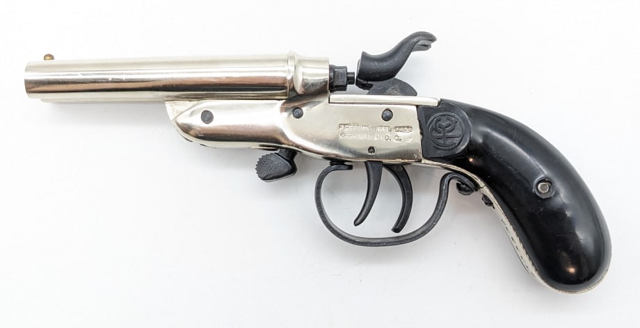 Rossi Exposed Hammer Double Barrel .22 Derringer: Rossi Exposed Hammer Double Barrel .22 Derringer. Features 2-7/8in barrels, chrome finish, engraved back strap, and black plastic grips. Pistol is in nice conditon with light wear from use and handlin