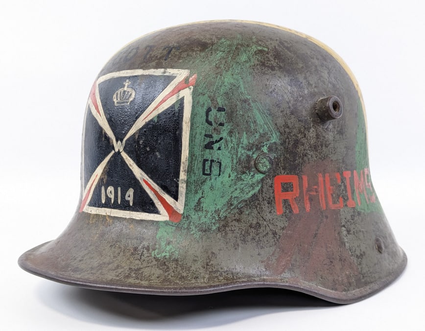 WWI German M16 Capture Painted Helmet: WWI German M16 Capture Painted Helmet. Helmet is covered in hand done paintings listing various locations of battle including Verdun, Rheims, and Chateau Thierry. Also includes imagery of Uncle Sam wi