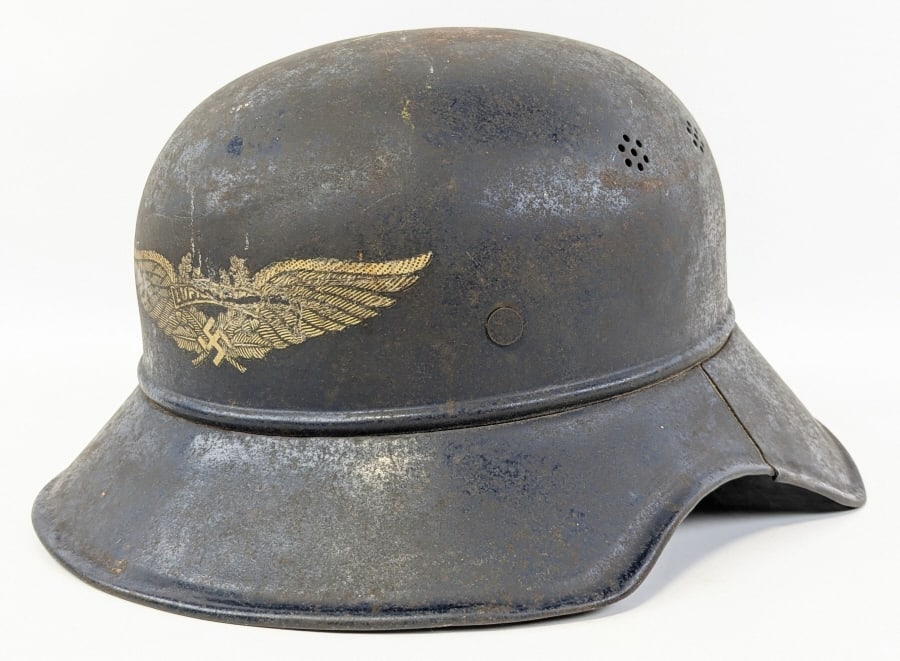 WWII German M38 Luftschutz Gladiator Helmet: WWII German M38 Luftschutz Gladiator Helmet. Helmet is marked with the Luftschutz eagle on the front, beaded edge, salt and pepper shaker holes, stamped R.L.2 39/10 on the inside back edge, and painte