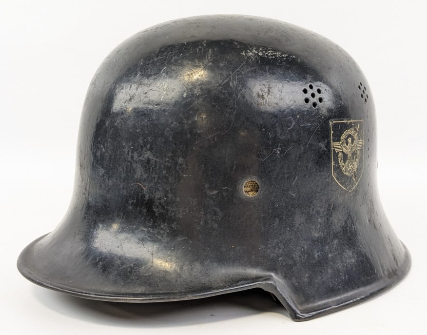 WWII German M34 Civic Police Double Decal Helmet: WWII German M34 Civic Police Double Decal Helmet. Helmet is marked with the police shield on the left side, party shield on the right side, Salt & Pepper style holes, and D.R.P. Thale on the inside ba