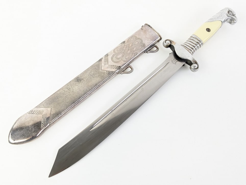 WWII German RAD Labor Service Officer Dagger: WWII German RAD Labor Service Officer Dagger w/ Scabbard. Dagger is made by ALCOSO Solingen and features a fullered clip point blade with the inscription "Arbeit adelt" the motto for the Reich Work Fo