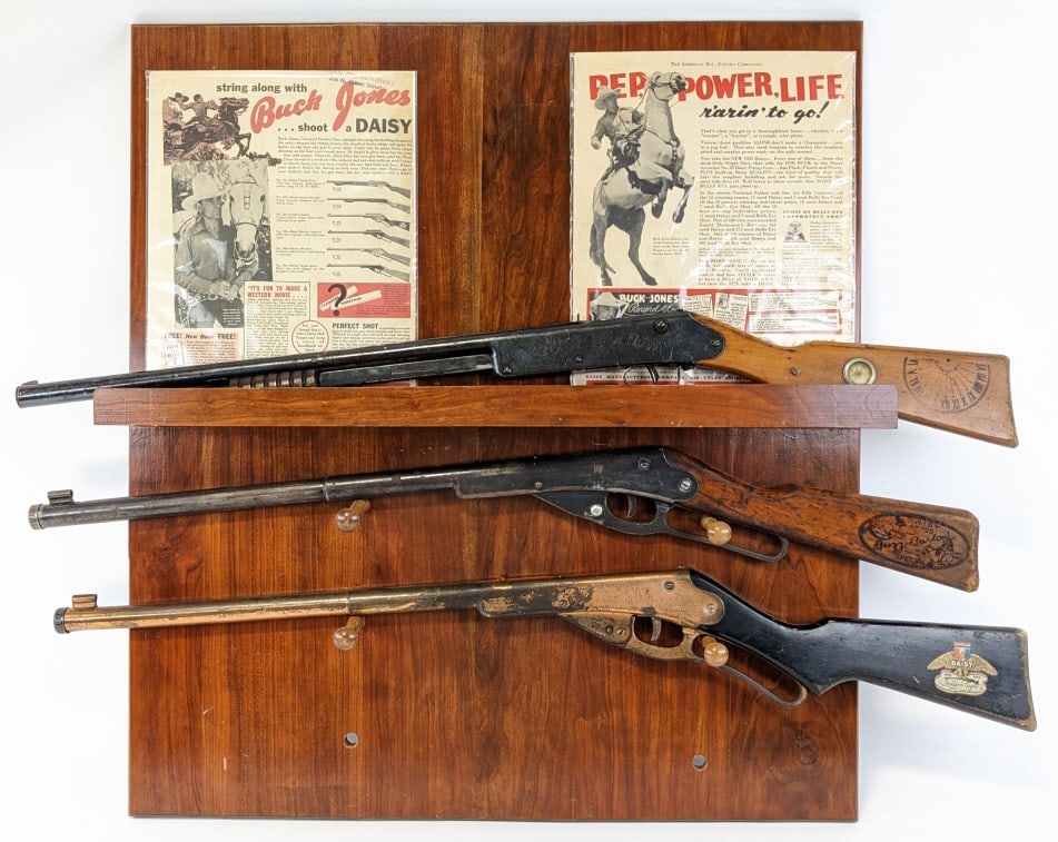Daisy Special Lever Action Air Rifle Display: Daisy Special Lever Action Air Rifle Display. Includes special Daisy model rifle like the 1936 Golden Eagle, Buck Jones, and Buzz Barton rifles. Display also comes with displayed pieces of literature.