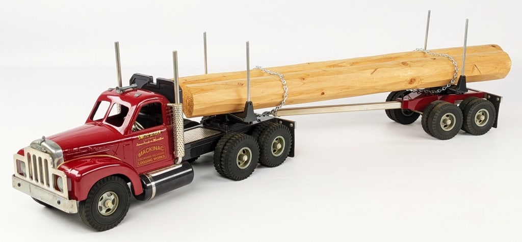 Fred T. Smith Miller Mackinac Log Hauler Truck: Fred Thompson Smith Miller B Mack Mackinac Logging Works truck and trailer. Displays well with realistic load, B Mack cab, and chrome features. Good condition with the foam lined box. Limited edition