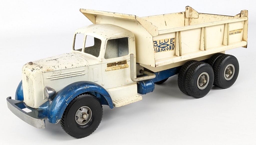 Original Smith Miller Blue Diamond Dump Truck: Original Smith Miller L Mack Blue Diamond dump truck. The truck has paint loss, scratches, discoloration, and wear from age. The hydraulic dump works, but is a little slow. Measures approximately 19" 
