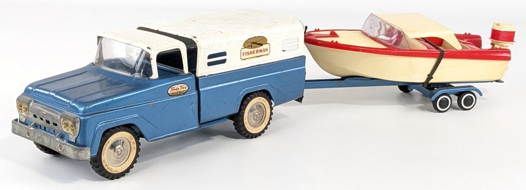 Original Tonka Fisherman Truck w/ Boat & Trailer: Original Tonka Fisherman truck with boat, trailer, and outboard motor. The outboard has damage to the mounting brackets and the canopy. The boat has some discoloration. The truck has some paint chips 