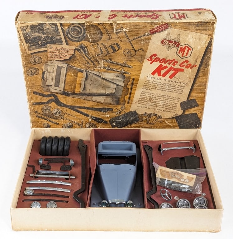 Original Doepke MG Sports Car Kit In Box: Original Doepke MG car kit in the in the original box. The set appears to be complete and unassembled in the box. The box has staining, tears, punctures, and wear from age. The box measures approximat